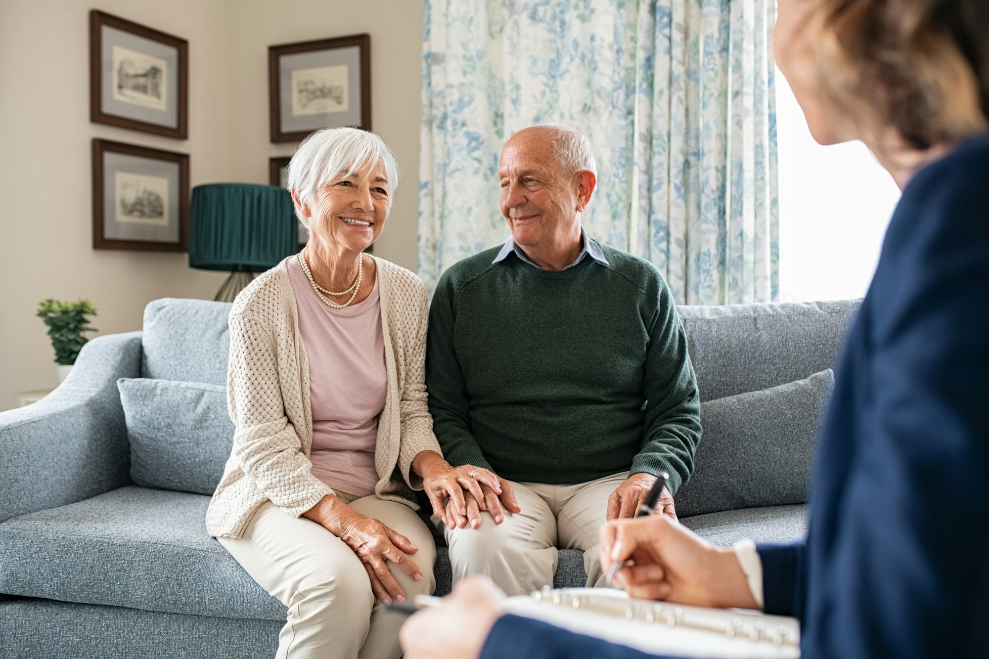 Social worker visiting seniors at home